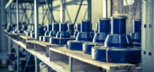 row of blue oilfield supply products designed by R&S Oilfield